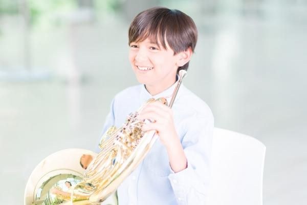 boy holding french horn